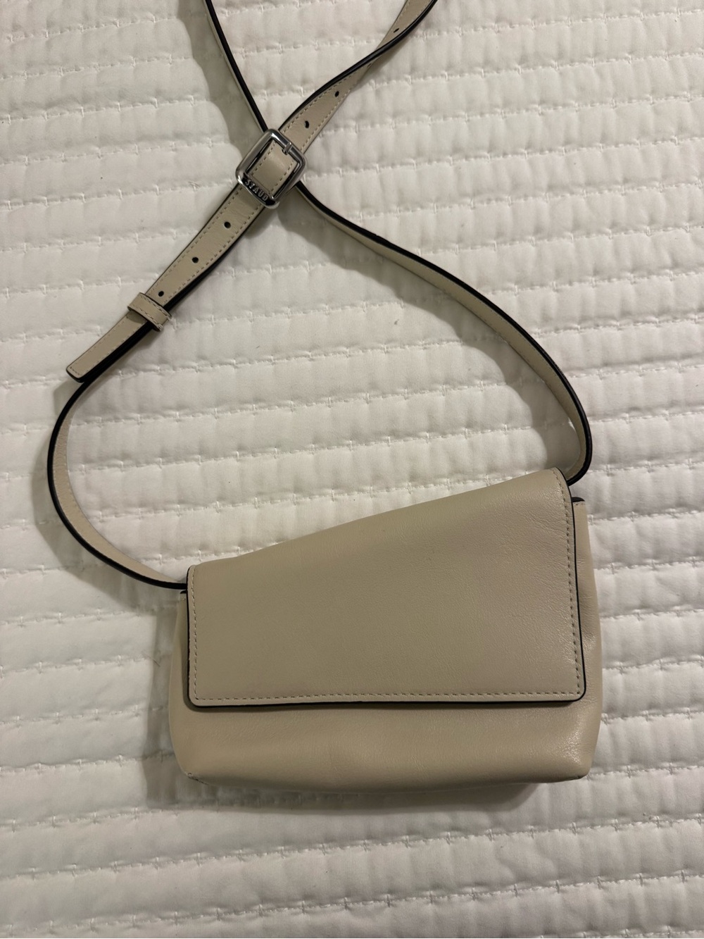 STAUD Cream Leather Asymmetrical Flap Crossbody Bag